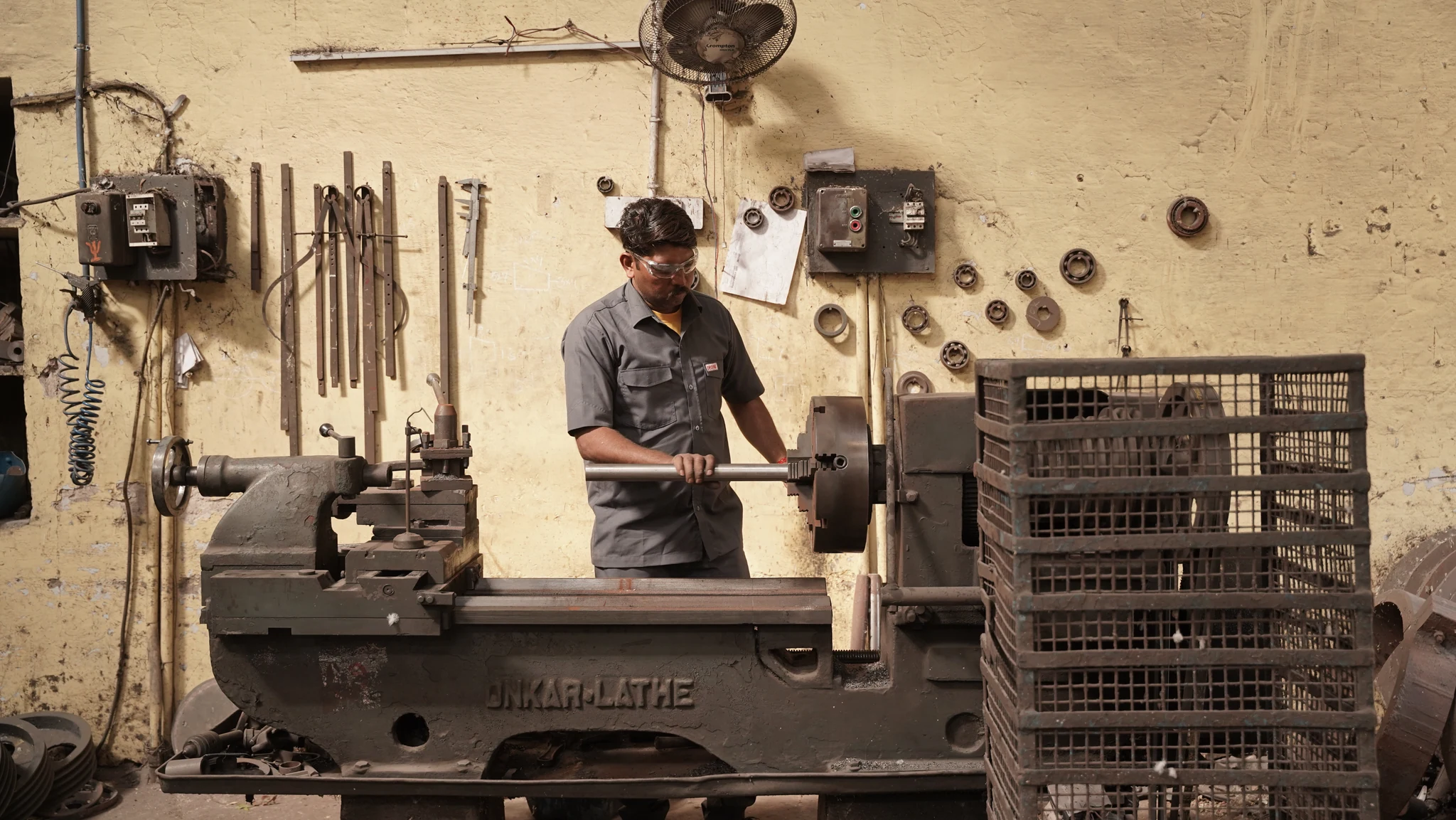 A Choyal craftsman working at a lathe in the factory